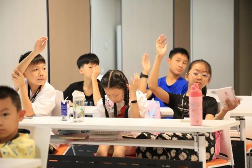 Students actively raise their hands